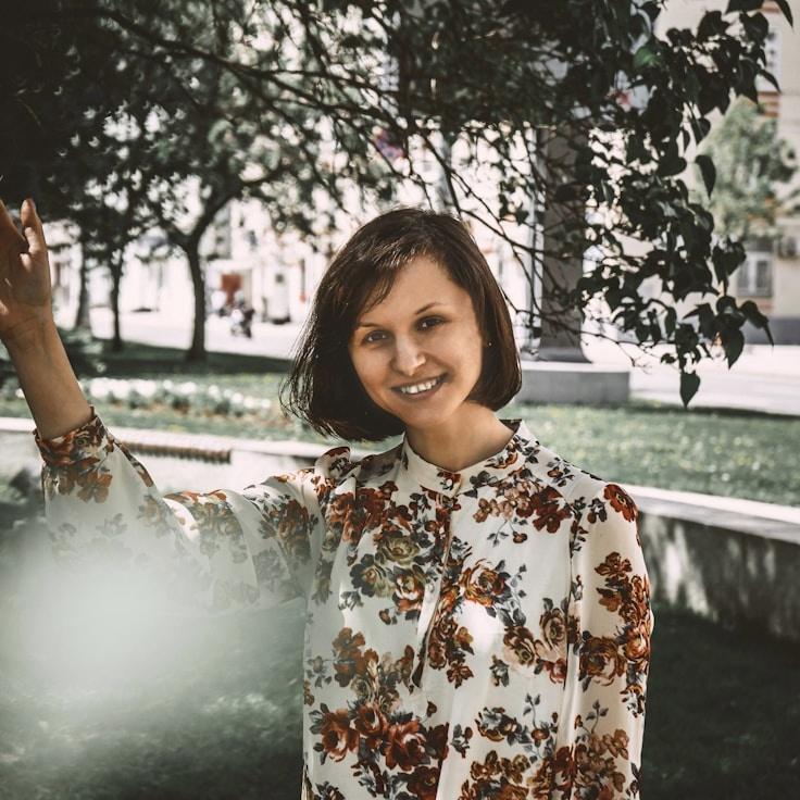 Alex Park, Lead Design Curator at Garden Node Craft, reviewing corporate floral arrangements